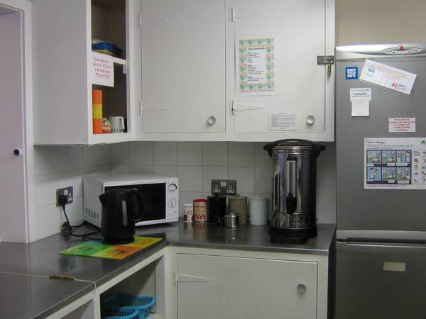 Kitchen, including kettle, microwave, fridge, and tea urn