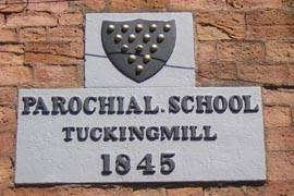 The "Parochial School" plaque built into the side of the building